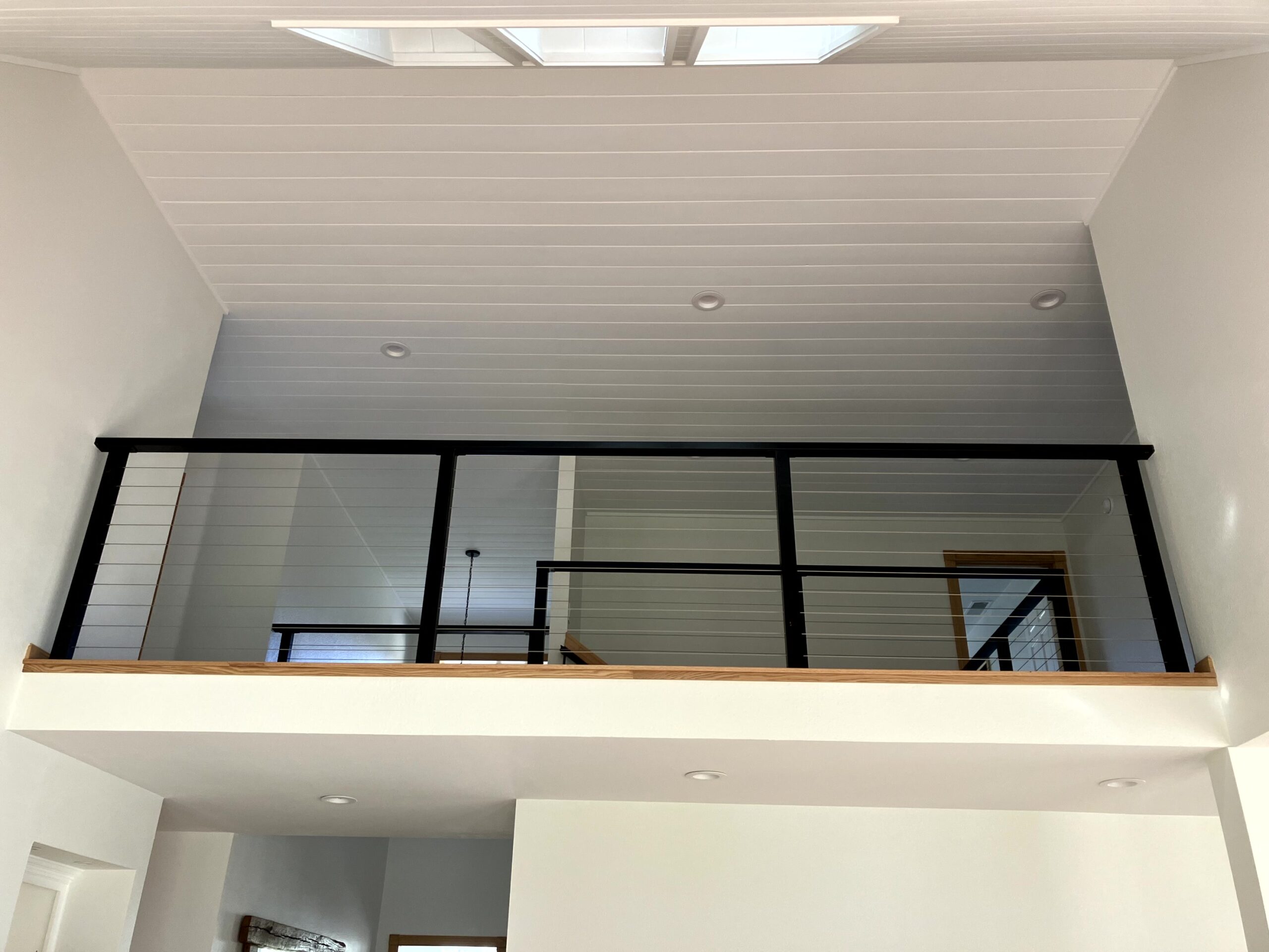 Waterman-Construction-Custom Waterman Construction custom second story railing inside a home.